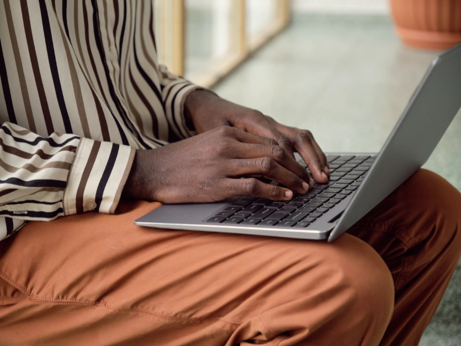 Close up of hands typing on laptop
